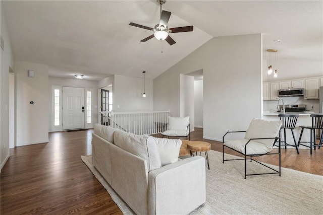 1835 Valentine Dr, Marion, IA 52302 - living area featuring lofted ceiling, ceiling fan, wood finished floors, and baseboards
