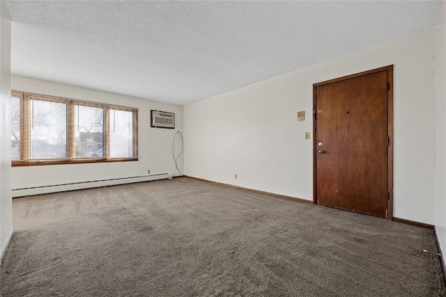 3212 Wilson Ave SW, Cedar Rapids, IA 52404 - carpeted spare room featuring baseboard heating, a textured ceiling, an AC wall unit, and baseboards