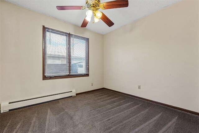 3212 Wilson Ave SW, Cedar Rapids, IA 52404 - empty room with a baseboard heating unit, dark carpet, baseboards, and a ceiling fan