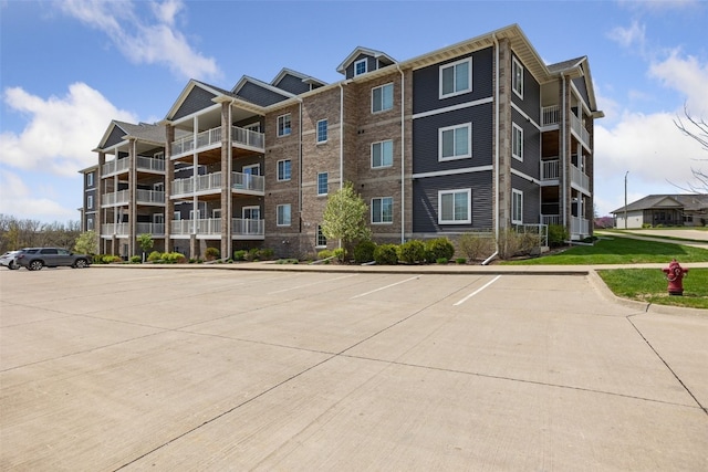 view of property featuring uncovered parking