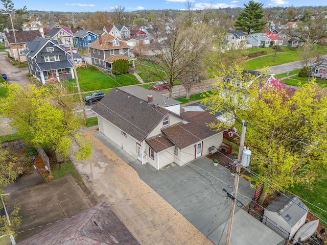 birds eye view of property with a residential view