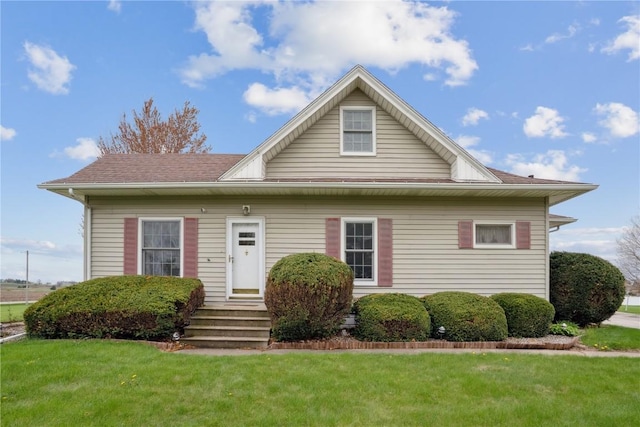 bungalow-style house with a front yard