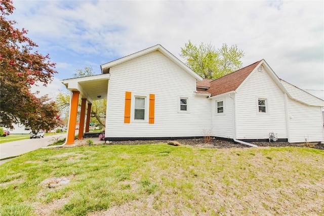 2095 3rd Ave, Marion, IA 52302 - view of property exterior with a lawn and roof with shingles