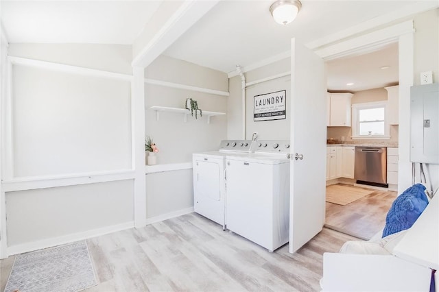 2095 3rd Ave, Marion, IA 52302 - laundry area with washing machine and dryer, light wood-type flooring, and electric panel