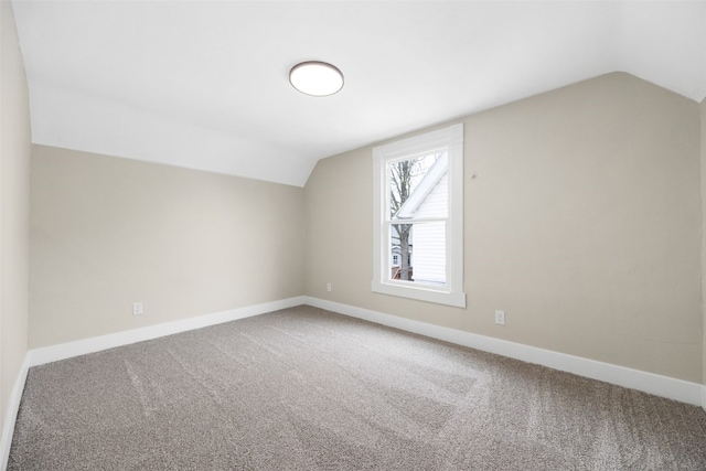 317 16th St NE, Cedar Rapids, IA 52402 - bonus room with vaulted ceiling, carpet, and baseboards