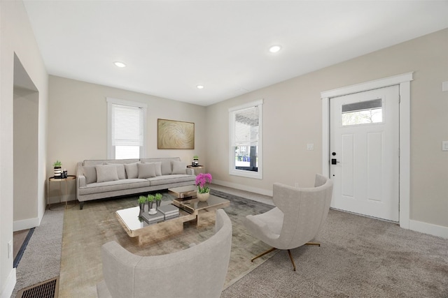 317 16th St NE, Cedar Rapids, IA 52402 - living area featuring plenty of natural light, baseboards, recessed lighting, and carpet