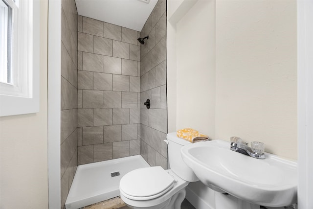317 16th St NE, Cedar Rapids, IA 52402 - bathroom with a stall shower, toilet, and a sink