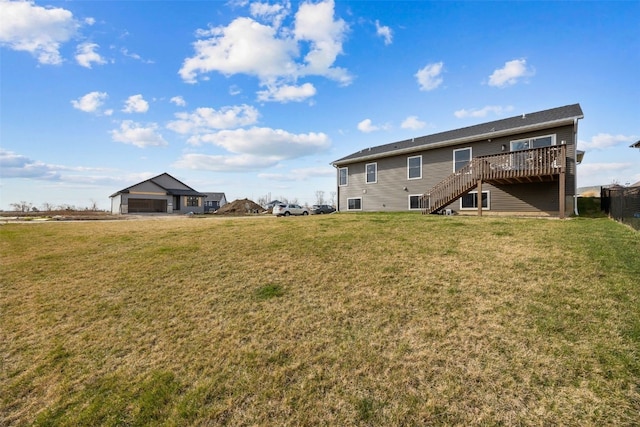 5116 Ruhd St SW, Cedar Rapids, IA 52404 - rear view of house with a lawn, a deck, and stairs