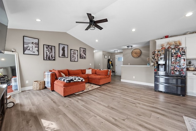 5116 Ruhd St SW, Cedar Rapids, IA 52404 - living area with baseboards, ceiling fan, vaulted ceiling, and light wood finished floors