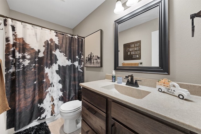 5116 Ruhd St SW, Cedar Rapids, IA 52404 - bathroom featuring vanity, tile patterned floors, toilet, and curtained shower