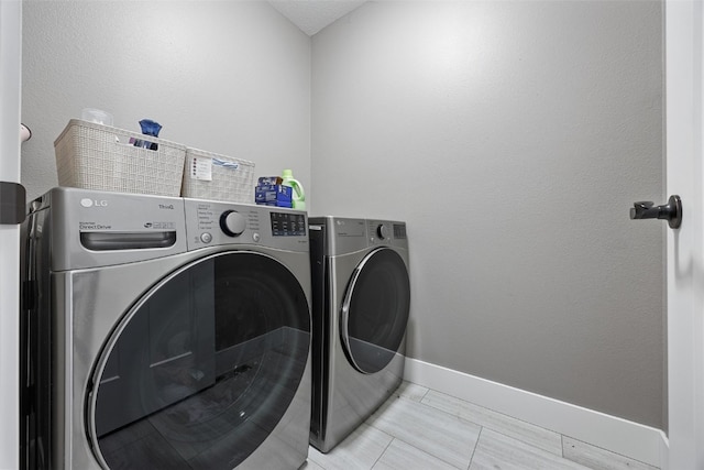 5116 Ruhd St SW, Cedar Rapids, IA 52404 - laundry area featuring baseboards, laundry area, and washer and dryer