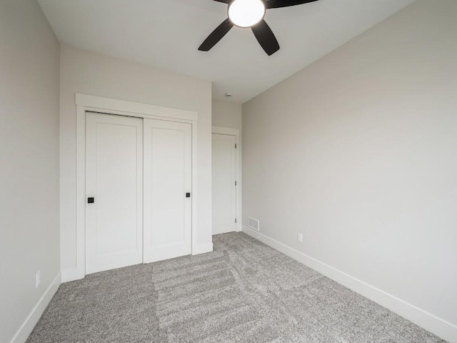 5497 Silver Ridge Rd, Marion, IA 52302 - unfurnished bedroom featuring a closet, baseboards, carpet flooring, and visible vents