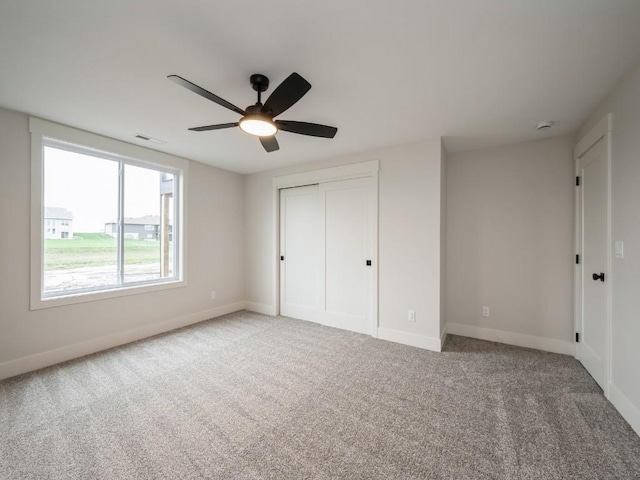 5497 Silver Ridge Rd, Marion, IA 52302 - unfurnished bedroom featuring a closet, baseboards, and carpet flooring