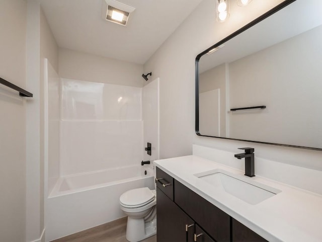 5497 Silver Ridge Rd, Marion, IA 52302 - full bath with vanity, toilet, wood finished floors, shower / bathing tub combination, and visible vents