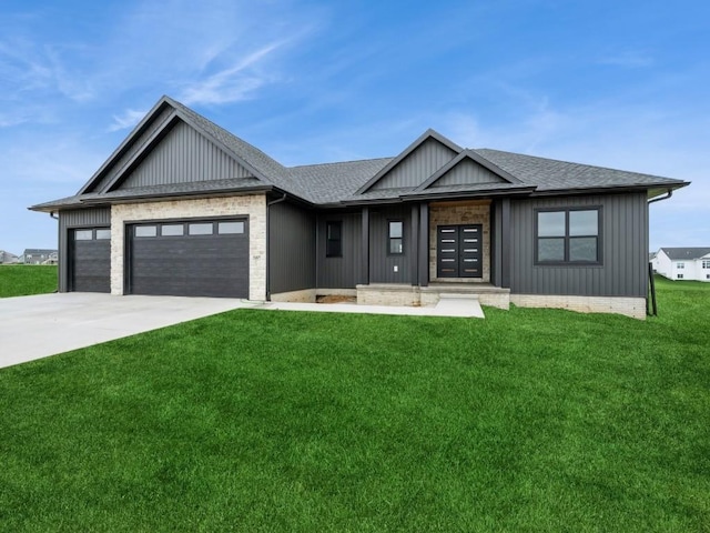 5497 Silver Ridge Rd, Marion, IA 52302 - view of front of home featuring an attached garage, driveway, a shingled roof, and a front lawn