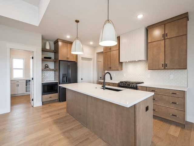 5497 Silver Ridge Rd, Marion, IA 52302 - kitchen with backsplash, open shelves, a sink, black appliances, and light wood-style flooring