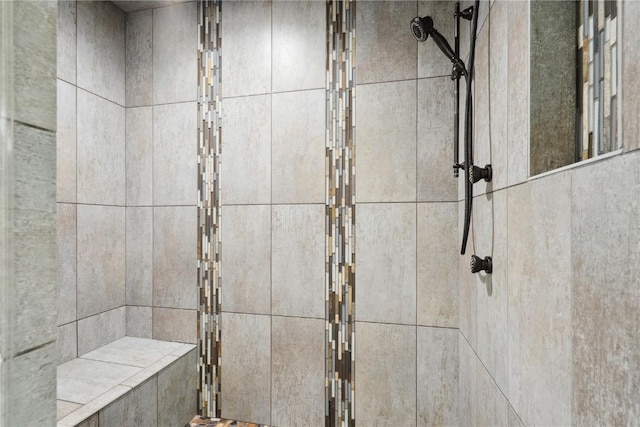 full bathroom featuring a tile shower