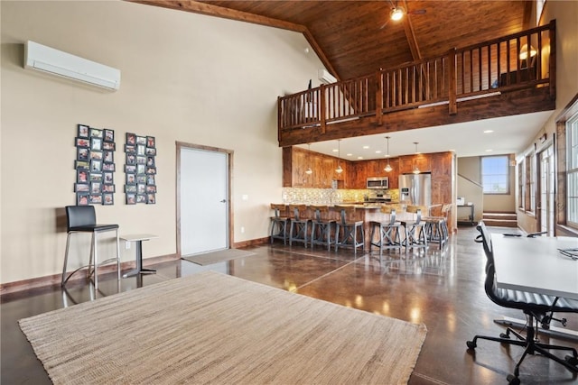living area with a wall mounted air conditioner, baseboards, high vaulted ceiling, and wooden ceiling