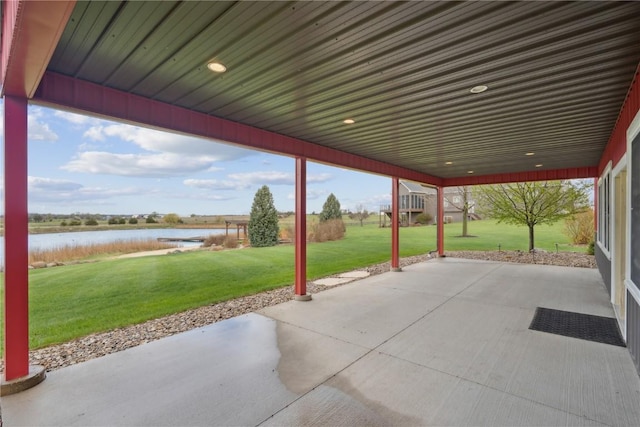 view of patio with a water view