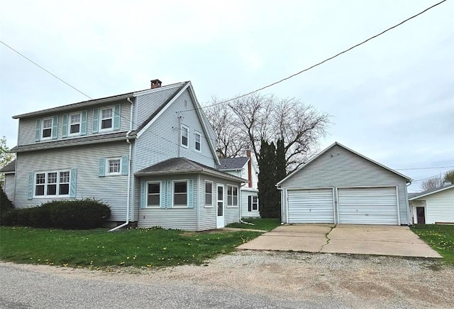 view of front of property with a chimney, a garage, an outdoor structure, and a front yard