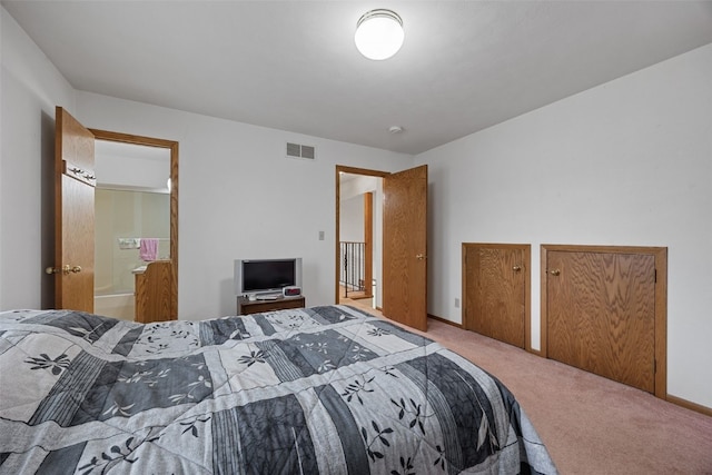 5823 Timber Creek Rd, Cedar Rapids, IA 52411 - carpeted bedroom with ensuite bathroom, two closets, and visible vents