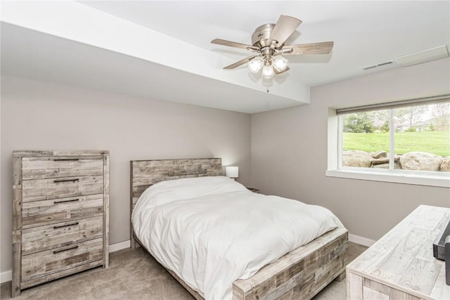 bedroom with light colored carpet, baseboards, and visible vents