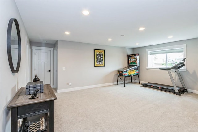 exercise room featuring carpet floors, recessed lighting, and baseboards