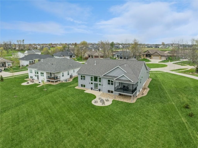 birds eye view of property with a residential view