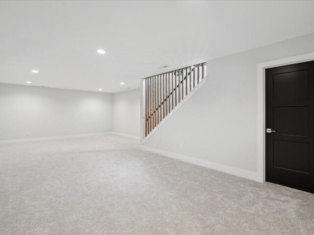 finished basement with baseboards, carpet, and recessed lighting