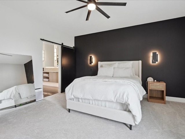 3120 Timber Ridge Ct, Hiawatha, IA 52233 - bedroom with carpet floors, a barn door, a ceiling fan, and ensuite bath
