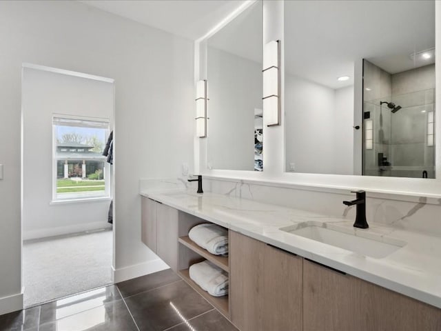 full bath featuring vanity, baseboards, recessed lighting, tile patterned floors, and a tile shower