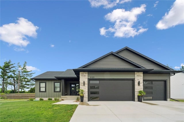 3120 Timber Ridge Ct, Hiawatha, IA 52233 - view of front of property featuring an attached garage, concrete driveway, board and batten siding, and a front yard