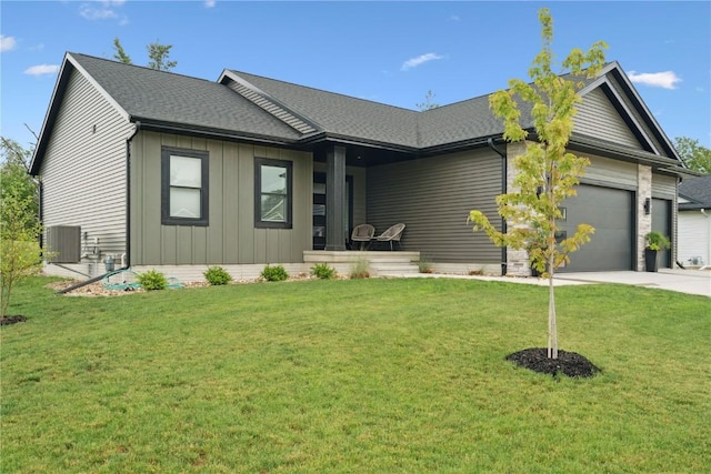 3120 Timber Ridge Ct, Hiawatha, IA 52233 - ranch-style house featuring driveway, an attached garage, a front lawn, and a shingled roof