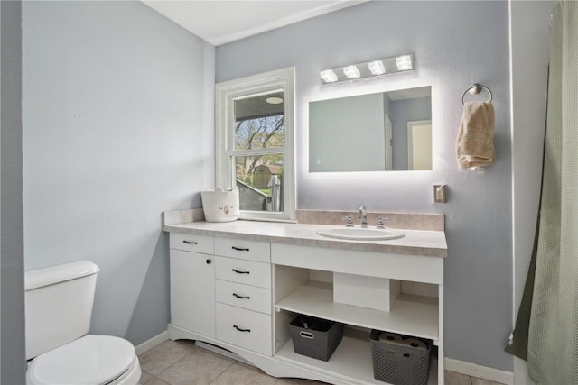 full bath featuring toilet, baseboards, tile patterned floors, and vanity