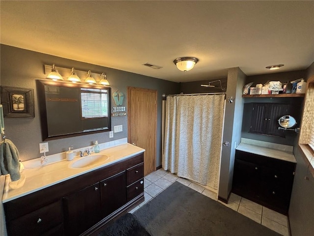 bathroom featuring a shower with curtain, tile patterned flooring, vanity, and visible vents