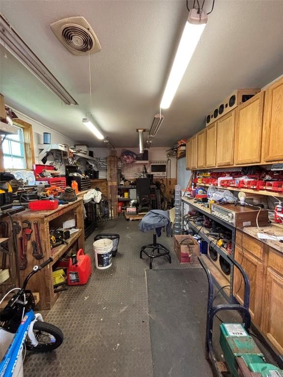 interior space featuring a workshop area and visible vents