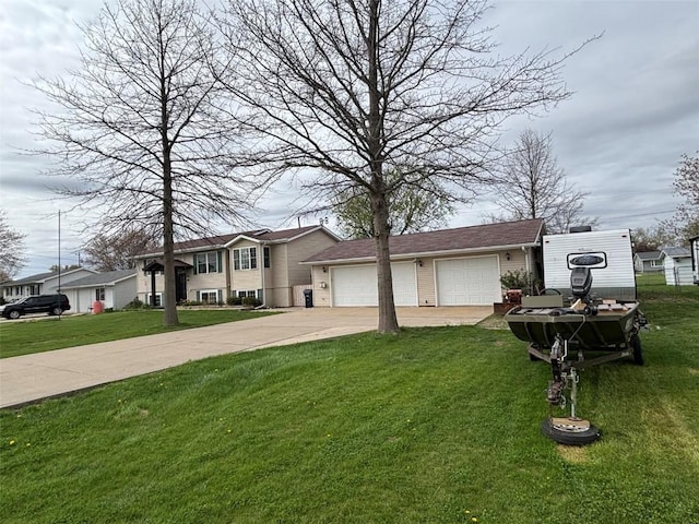 view of front of house with a garage, a front lawn, an outbuilding, and driveway