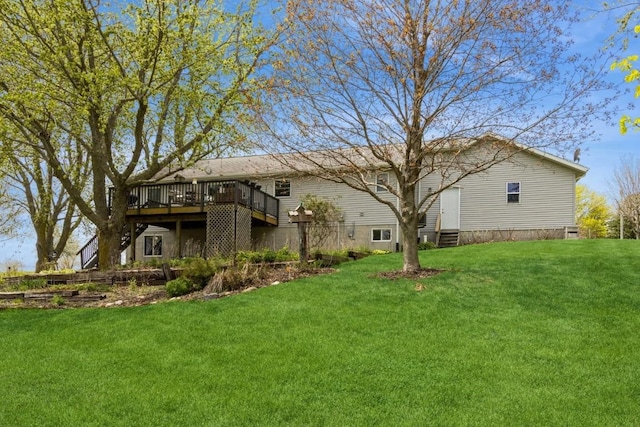 back of house with a wooden deck, a yard, and entry steps