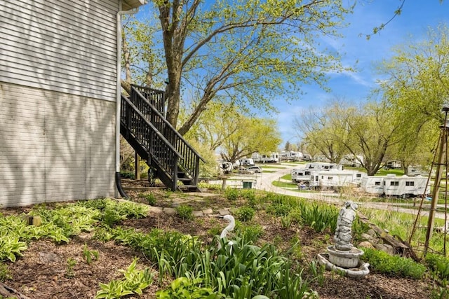 view of yard featuring stairway