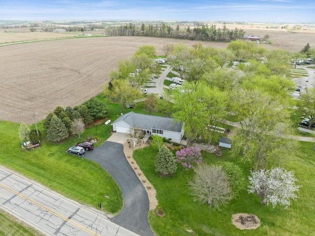 birds eye view of property with a rural view