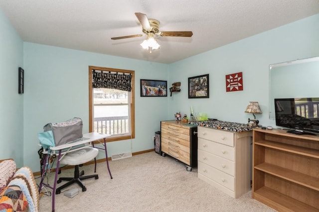 bedroom featuring baseboards, light colored carpet, ceiling fan, and visible vents