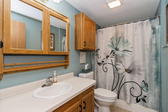 bathroom with toilet, a textured ceiling, a shower with shower curtain, and vanity
