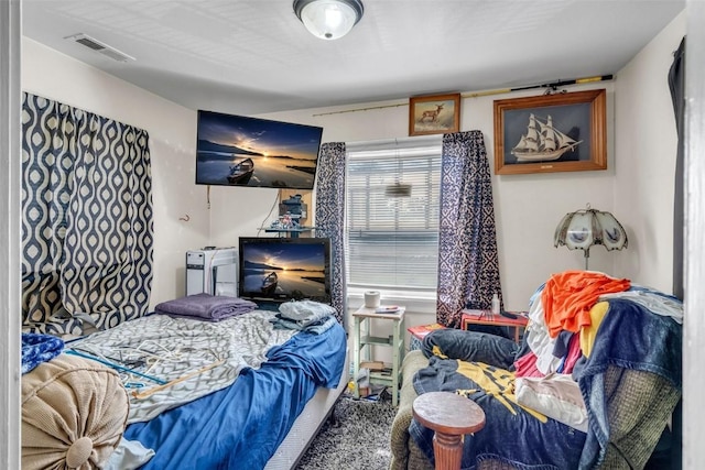 bedroom featuring visible vents