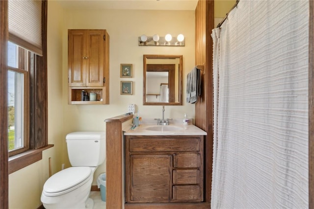 bathroom featuring toilet and vanity