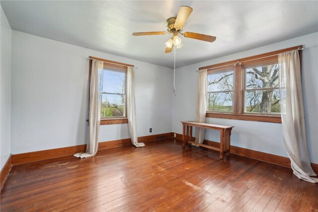 527 Swisher View Dr SW, Swisher, IA 52338 - empty room with wood-type flooring and ceiling fan