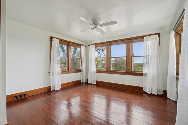 527 Swisher View Dr SW, Swisher, IA 52338 - unfurnished room with wood-type flooring and ceiling fan
