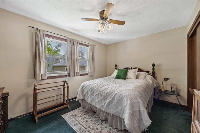 bedroom with carpet floors, a ceiling fan, and a textured ceiling