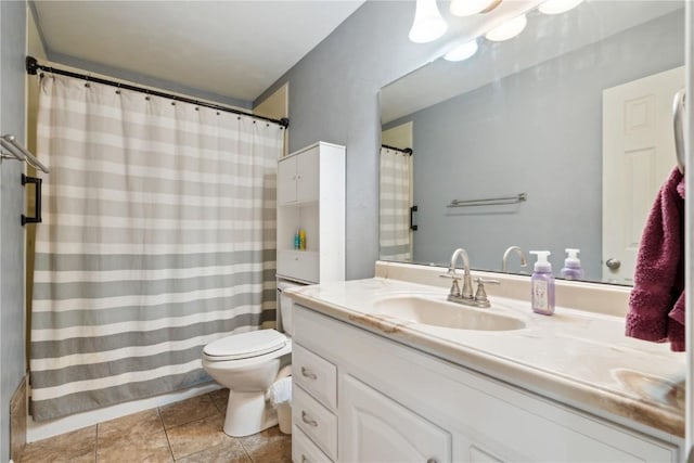 bathroom featuring vanity, tile patterned flooring, toilet, and curtained shower