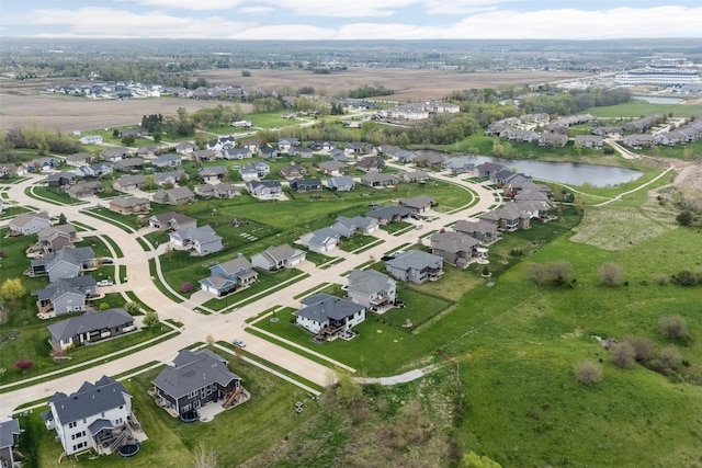 aerial view with a residential view and a water view