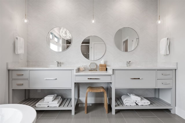 full bathroom with vanity and tile patterned floors
